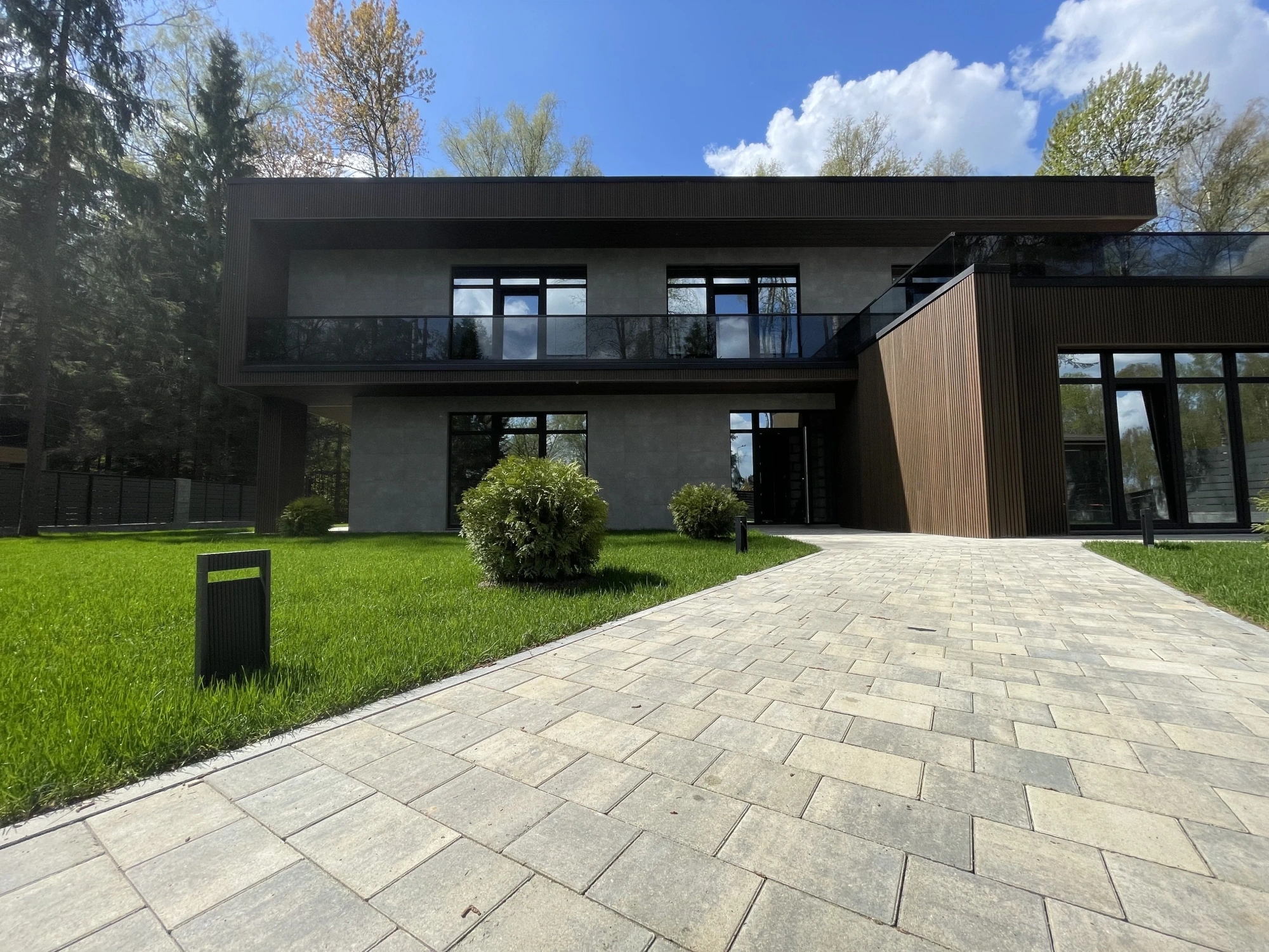 Stone coloured paving outside a modern house