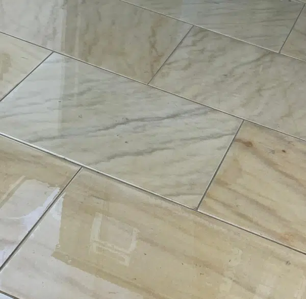 Close view of warm toned natural stone paving slabs