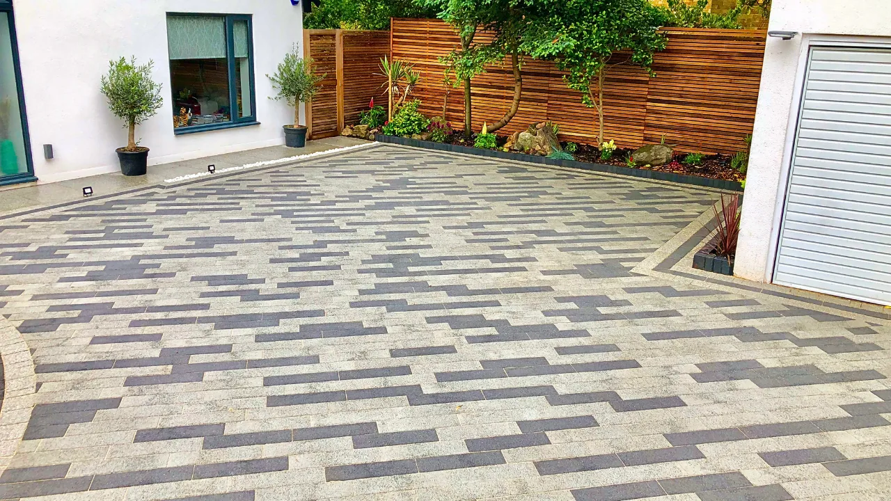 Completed two-tone block paved driveway with contrasting rectangular blocks