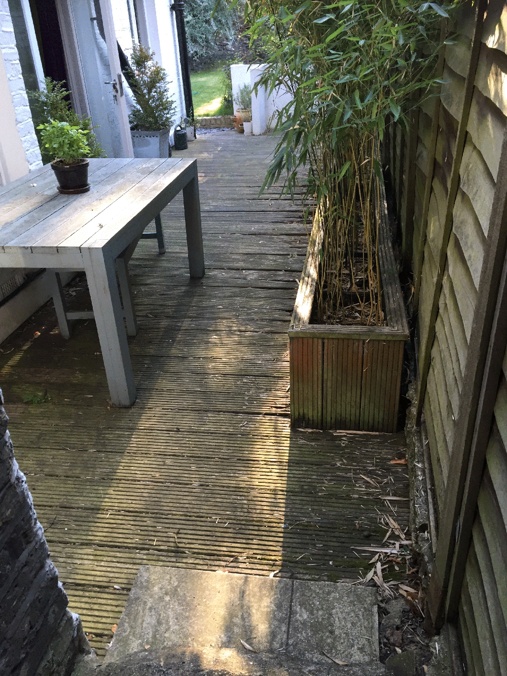 Existing timber decking before replacement with paving